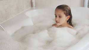 Stock Video Little Girl Plays With The Foam From Her Tub Animated Wallpaper
