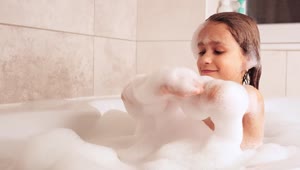 Stock Video Little Girl Plays While Taking A Bath Animated Wallpaper