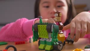 Stock Video Little Girl Playing With Lego Toys Animated Wallpaper