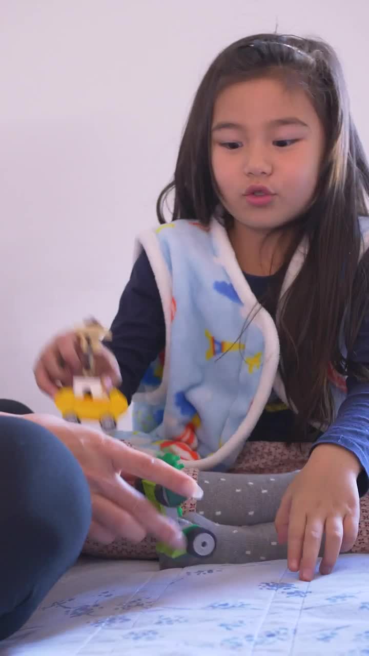 Download Stock Video Little Girl Playing With Her Mom Animated Wallpaper