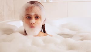 Stock Video Little Girl Playing With Foam In Her Bath Animated Wallpaper