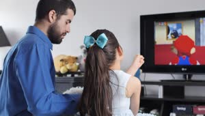 Stock Video Little Girl Playing Video Games With Her Father Animated Wallpaper
