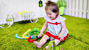 Stock Video Little Girl Playing On The Carpet Animated Wallpaper