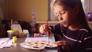Stock Video Little Girl Painting With Watercolors At Home Animated Wallpaper