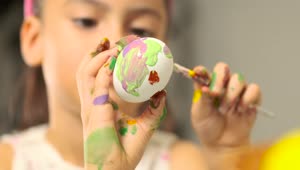 Stock Video Little Girl Painting Easter Eggs Shallow Focus Animated Wallpaper