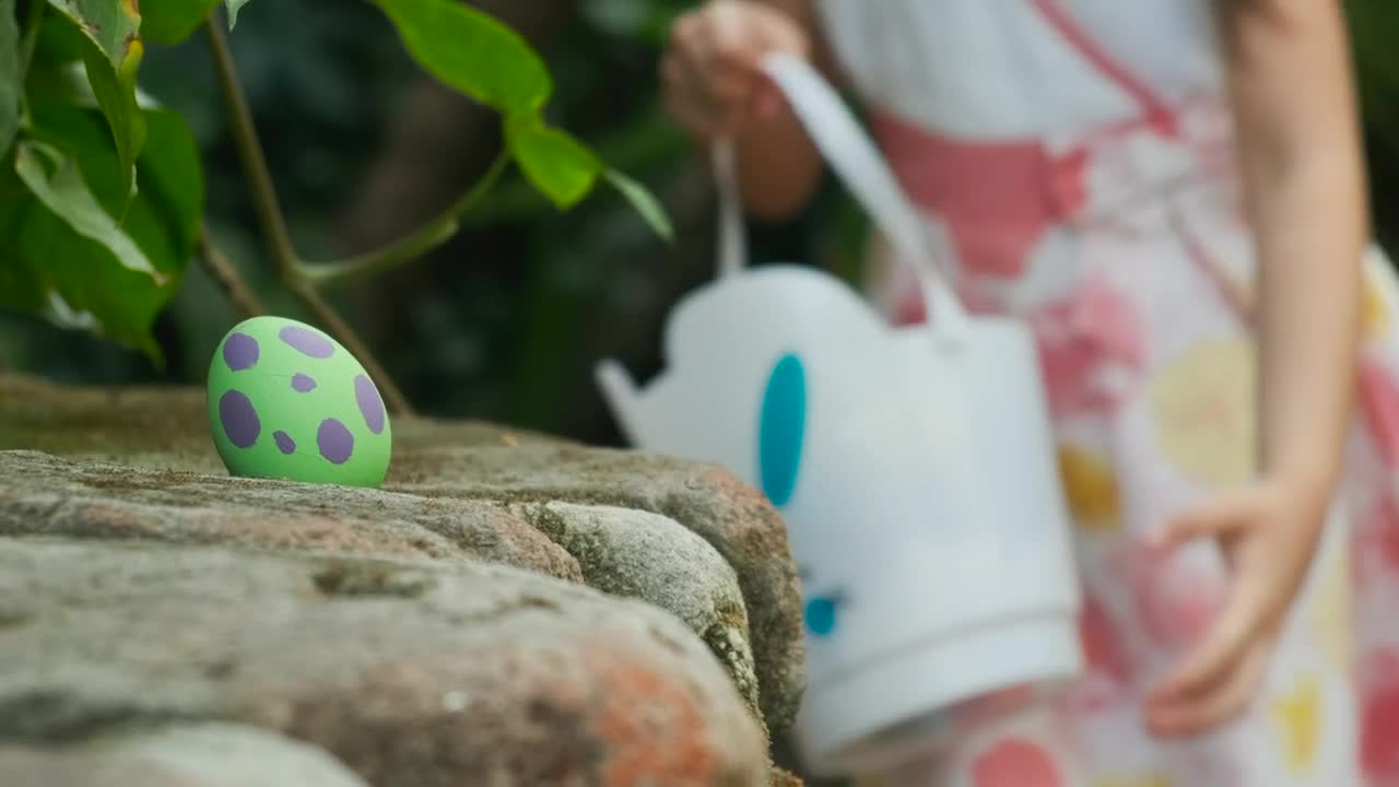 Download Stock Video Little Girl Looking For Easter Eggs Animated Wallpaper
