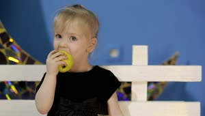 Stock Video Little Girl Healthy Eating An Apple Animated Wallpaper