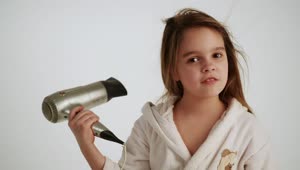 Stock Video Little Girl Drying Her Hair After A Bath Animated Wallpaper