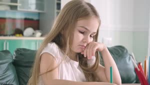 Stock Video Little Girl Doing Her Math Homework Animated Wallpaper