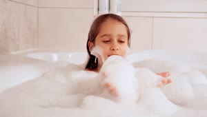 Stock Video Little Girl Covered In Foam In The Tub Animated Wallpaper