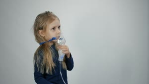 Stock Video Little Girl Breathing With Inhalation Device Animated Wallpaper
