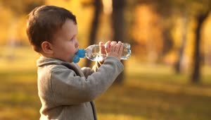 Stock Video Little Boy Drinking Water From A Bottle Animated Wallpaper
