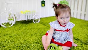 Stock Video Little Baby Girl Playing In The Garden Animated Wallpaper