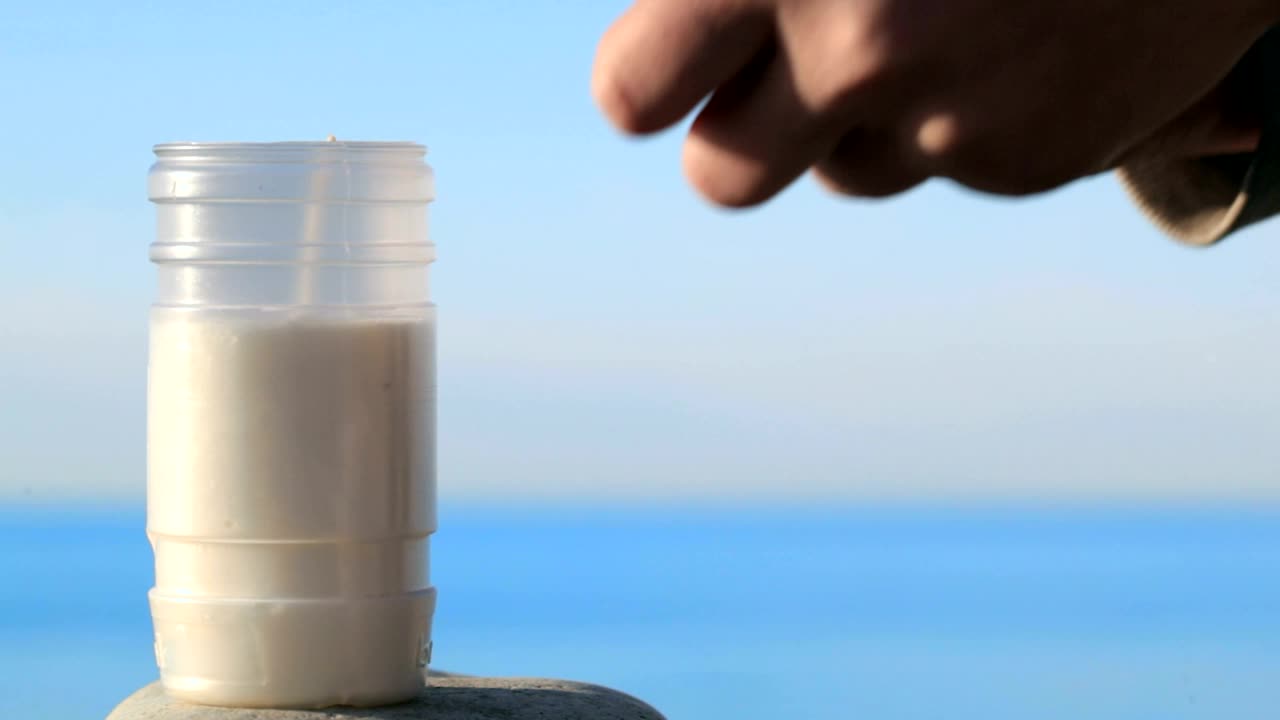 Download Stock Video Lighting A Candle With A Match Animated Wallpaper