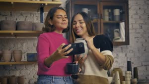 Stock Video Lgbtq Girlfriends Taking A Selfie In A Pottery Shop Animated Wallpaper