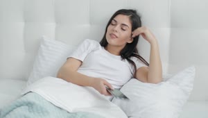 Stock Video Lazy Woman On Mobile Phone In Bed Animated Wallpaper