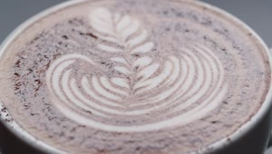 Stock Video Latte Leaf Drawing In A Cup Macro Close Up Animated Wallpaper