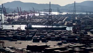 Stock Video Large Container Area On A Shoreline On A Sunny Day Animated Wallpaper