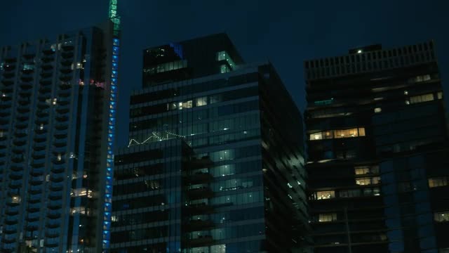Download Stock Video Large Buildings Of A City At Dusk Smal Animated Wallpaper