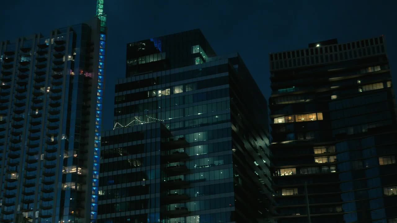 Download Stock Video Large Buildings Of A City At Dusk Animated Wallpaper