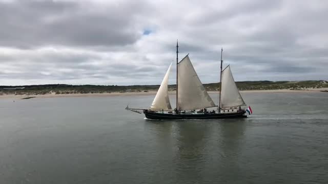 Download Stock Video Large Boat Sailing By An Island Smal Animated Wallpaper