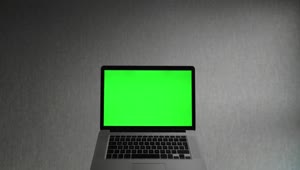 Stock Video Laptop Computer With A Green Screen Animated Wallpaper