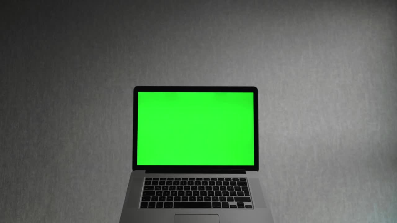 Download Stock Video Laptop Computer With A Green Screen Animated Wallpaper