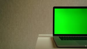 Stock Video Laptop Devise With A Green Screen Animated Wallpaper