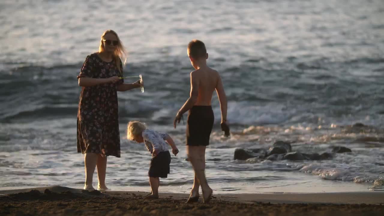 Download Stock Video Mother Playing With Her Two Childre Animated Wallpaper