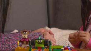 Stock Video Mother Playing With Her Daughter With Lego Piece Animated Wallpaper
