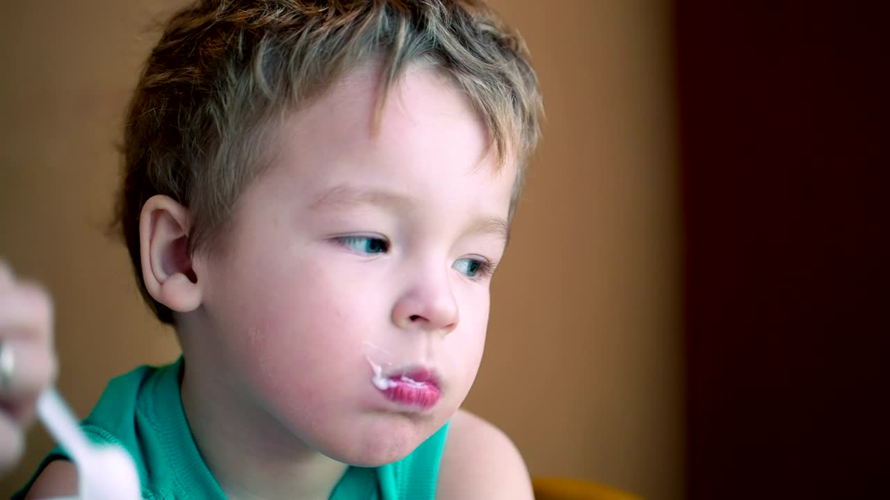 Download Stock Video Mother Feeding Her Child With A Spoo Animated Wallpaper