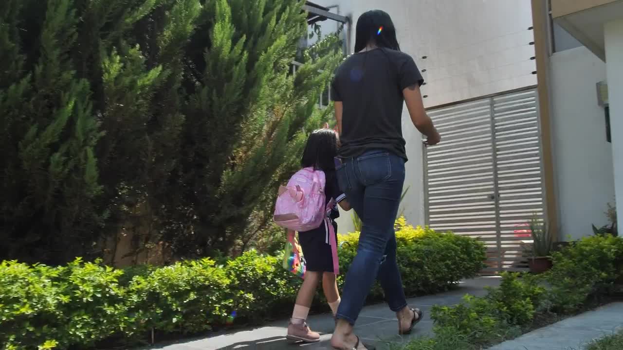 Download Stock Video Mother Coming Home After Picking Up Her Daughter From Schoo Animated Wallpaper