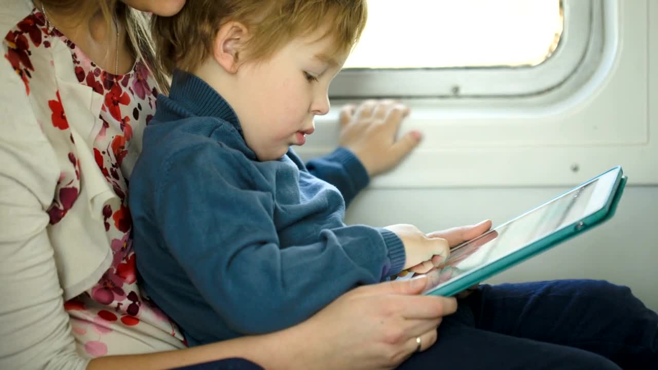 Download Stock Video Mother And Young Child Using A Table Animated Wallpaper