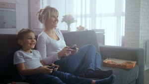 Stock Video Mother And Son Playing Video Games Togethe Animated Wallpaper