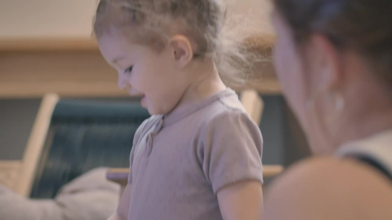 Download Stock Video Mother And Daughter Putting Together A Puzzl Animated Wallpaper