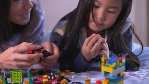 Stock Video Mother And Daughter Playing Together With Lego Animated Wallpaper