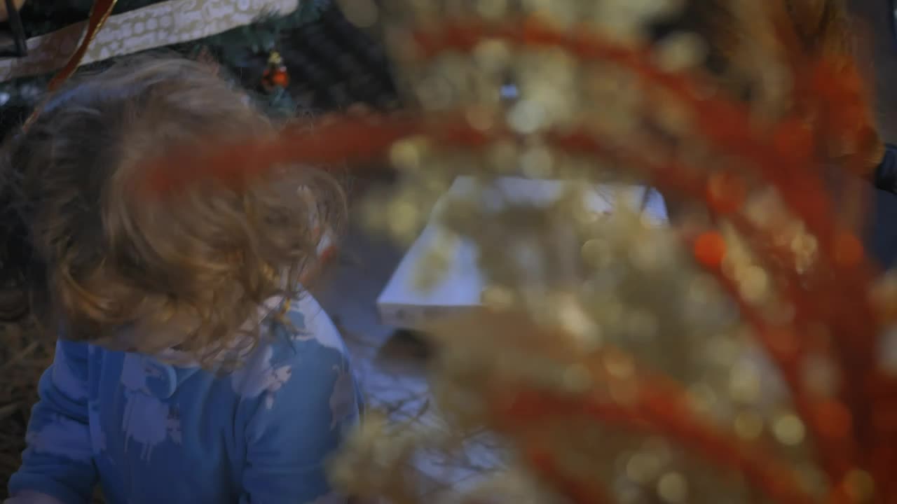 Download Stock Video Mother And Daughter Opening Christmas Gift Animated Wallpaper