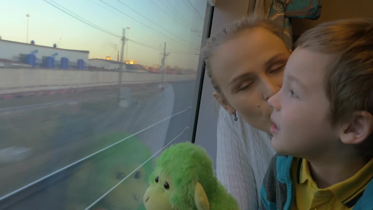 Download Stock Video Mother And Child Sharing A Train Journe Animated Wallpaper