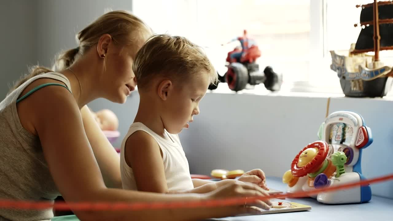 Download Stock Video Mother And Child Playing With Learning Block Animated Wallpaper