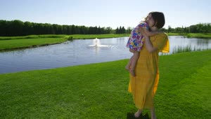 Stock Video Mother And Child By A Lake Fountai Animated Wallpaper