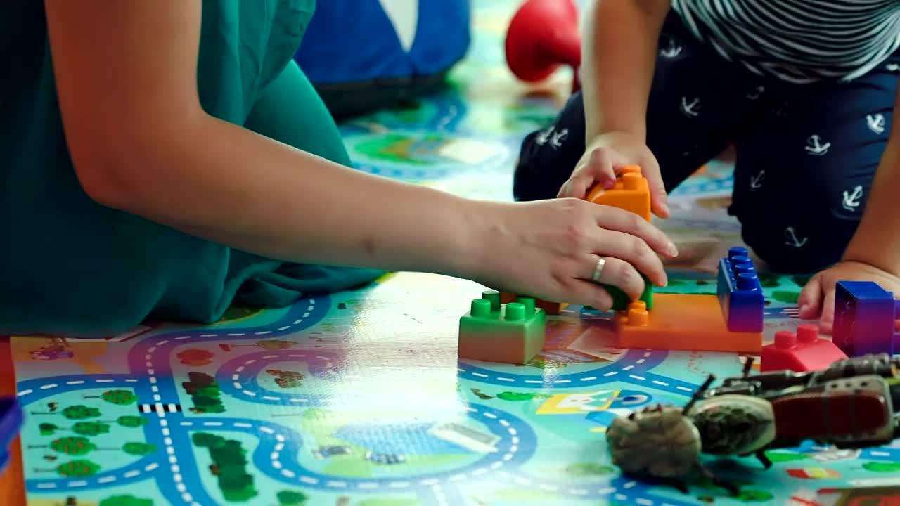 Download Stock Video Mother And Child Building With Block Animated Wallpaper