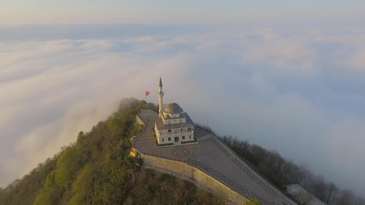 Download Stock Video Mosque Building At The Top Of A Cloudy Mountai Animated Wallpaper