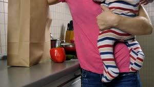 Stock Video Mom With Her Baby In Her Hands Starts Cookin Animated Wallpaper