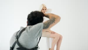 Stock Video Model Posing For Photographer In White Studi Animated Wallpaper
