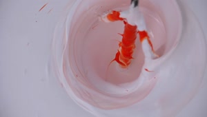 Stock Video Mixing White Paint With Orang Animated Wallpaper