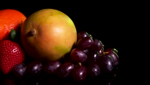 Stock Video Mixed Fruit On A Dark Tabl Animated Wallpaper