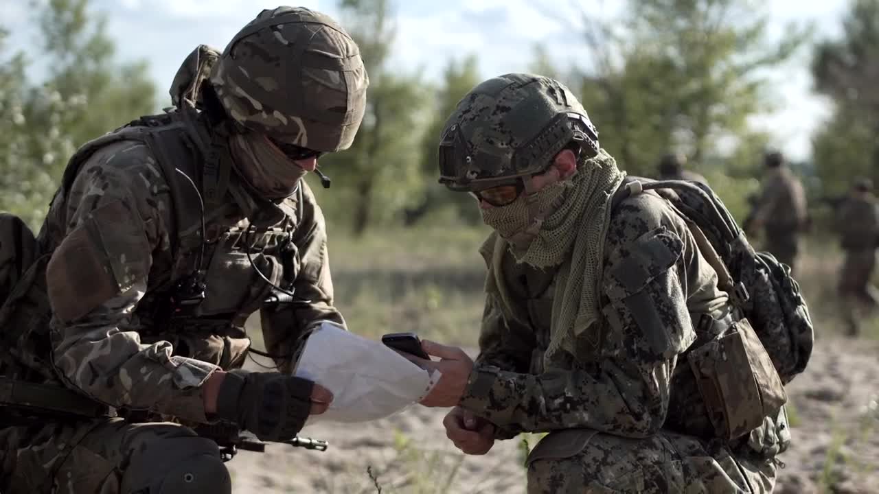 Download Stock Video Military Men Looking At Cell Phone And Ma Animated Wallpaper