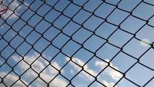 Stock Video Metal Mesh With Blue Sky In The Backgroun Animated Wallpaper