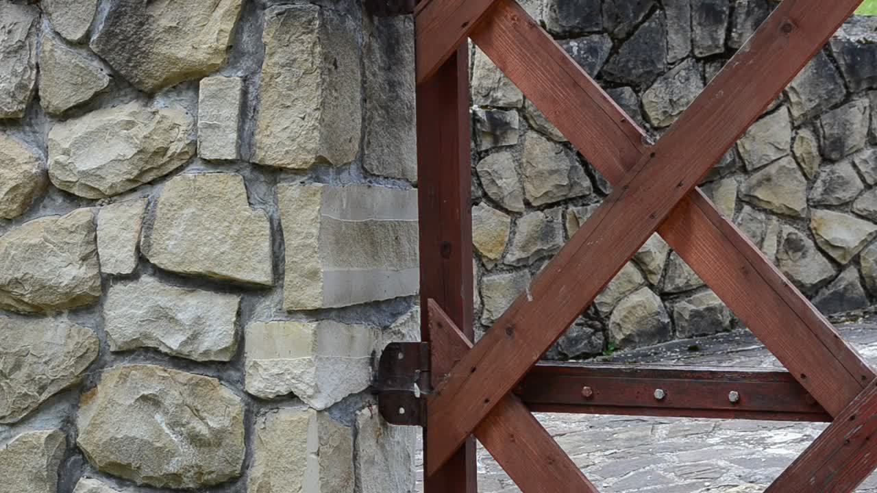 Download Stock Video Metal Gate Against A Stone Wal Animated Wallpaper