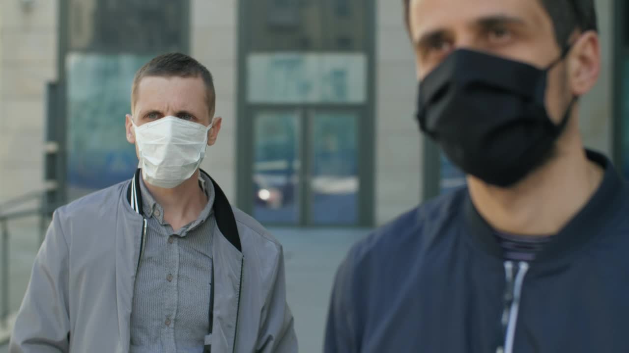 Download Stock Video Men Wearing Face Masks And Social Distancin Animated Wallpaper